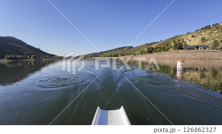 morning rowing on calm water of Horsetooth reservoir in Colorado - POV rower perspective 126862327