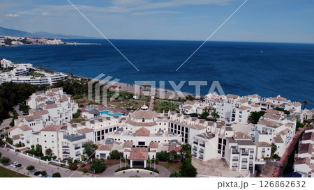 Aerial view of architecturally-designed modern prestige homes with pools in outer suburban Spain Aerial view of architecturally-designed modern prestige homes with pools in outer suburban Spain 126862632