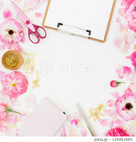 Lifestyle concept with roses flowers with clipboard on white background. Flat lay, Top view. 126862665