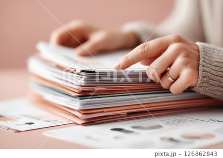 Professional Hands Organizing Business Documents and Reports 126862843