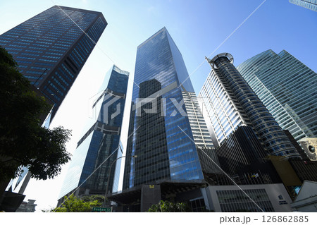 Low-angle building view of the modern office skyscrapers in the financial district of Raffles Place, Singapore. 126862885