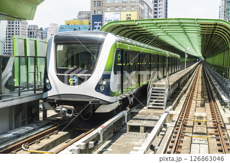 A Green Line train running on the elevated track of the Taichung Rapid Transit System in Taiwan.  126863046