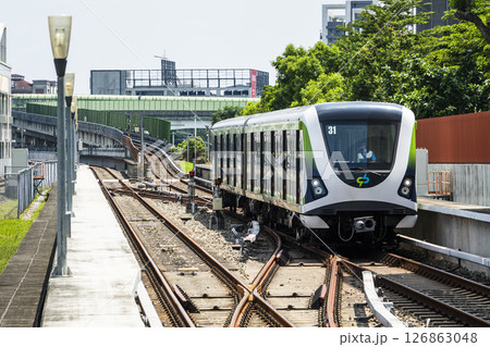 A Green Line train running on the elevated track of the Taichung Rapid Transit System in Taiwan.  126863048