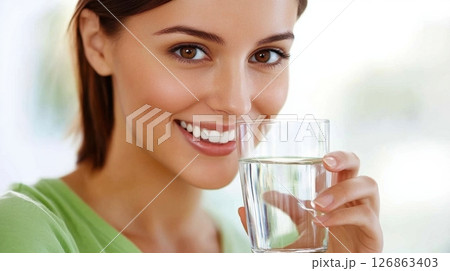 Enjoying a refreshing drink indoors 126863403