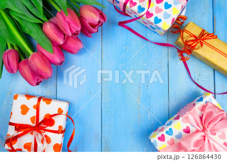 Pink tulips on wooden blue background. Conception holiday, March 8, Mother's Day. Flat lay and copy space 126864430