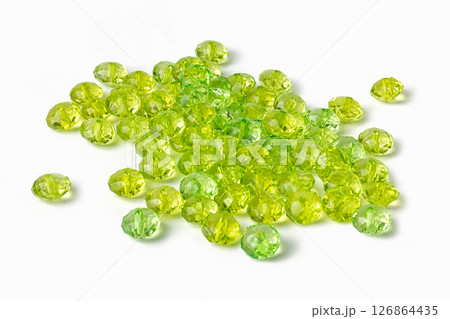 green acrylic beads on a white background 126864435
