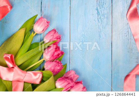 Bouquet of tulips on blue wooden table. Happy women's day. 8 March., Mother's Day. 126864441