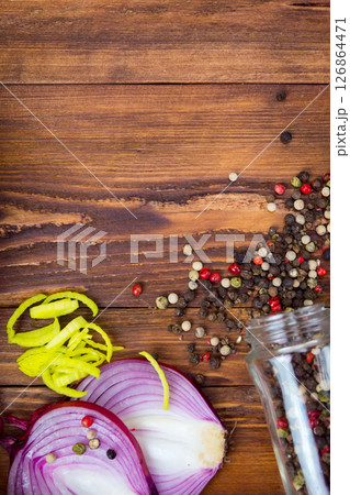 DIFFERENT SPICES FOR COOKING FOOD ON A DARK WOODEN BACKGROUND DIFFERENT SPICES FOR COOKING FOOD ON A DARK WOODEN BACKGROUND 126864471