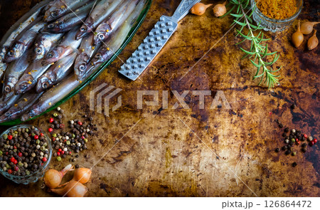 Fresh fish top view. Spicy herb and vegetables. Spice on wooden board. Healthy food cooking. Fresh fish top view. Spicy herb and vegetables. Spice on wooden board. Healthy food cooking. 126864472