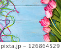 tulips on a blue background. the photo is stylized into a drawing 126864529