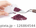 Powder Being Scooped From a Container With a Knife for Crafting or Artistic Projects 126864544