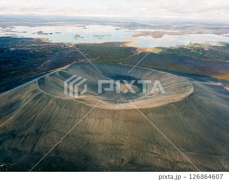 Breathtaking aerial view of a volcanic crater in Iceland showcasing its unique geological features and surrounding landscape Breathtaking aerial view of a volcanic crater in Iceland showcasing its unique geological features and surrounding landscape 126864607