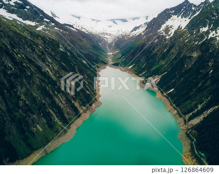 Breathtaking view of Schlegeisspeicher with turquoise waters surrounded by towering mountains in Austria 126864609