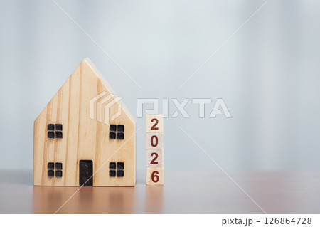 Wooden House Model with 2026 Blocks, Symbolizing Future Housing Plans 126864728