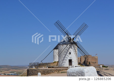 Historic windmills in spain against clear blue sky - cultural landmark and scenic view. Consuegra. La Mancha. Spain 126865206