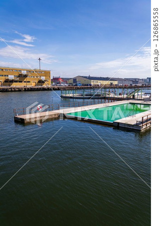 Floating swimming pools with sauna at Allmanna harbour bath in Frihamnen, Gothenburg, Sweden, sunny day 126865558