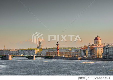 ice drift on the Neva River with a view of the arrow of Vasilyevsky Island with rostral columns, the Winter Palace, St. Isaac's Cathedral, the Savior on Spilled Blood 126866303
