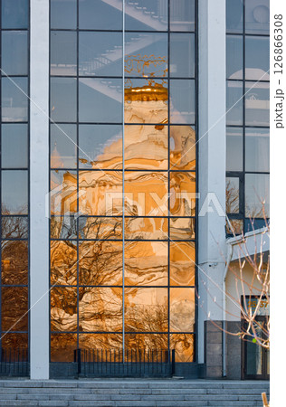reflection of the Prince Vladimir Cathedral on the glass facade of the building in springtime 126866308