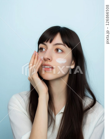 Skincare beauty with cream on female face, model portrait in cosmetics and serum routine 126866508