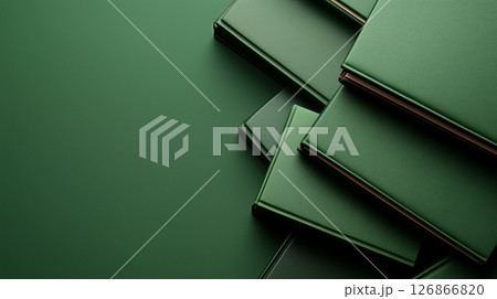 Elegant green leather books on minimalist green background with empty space. Business and education banner 126866820