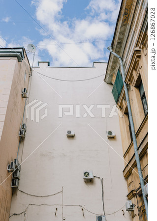 Air conditioning on facade of building and windows in the southern hot country. 126867028