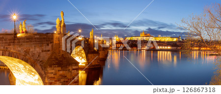 Illuminated Charles Bridge in Prague Czech Republic at dusk Illuminated Charles Bridge in Prague Czech Republic at dusk 126867318