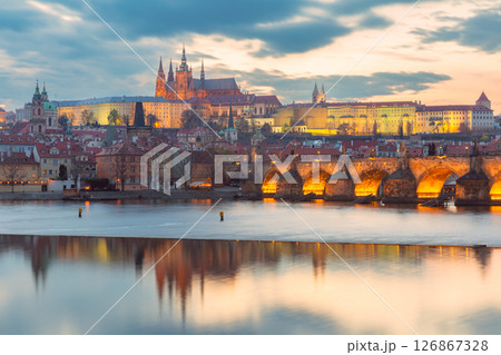 Vltava River and historic Prague at sunset in Prague Czech Republic 126867328