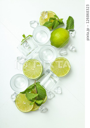Glasses with fresh lime and ice cubes Glasses with fresh lime and ice cubes 126868323