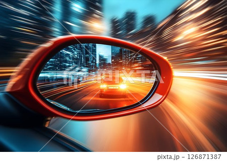Speeding Car Reflected in a Red Mirror with City Lights and Moti 126871387
