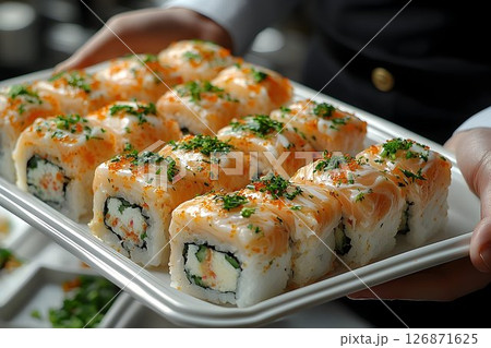 Freshly Prepared Salmon Sushi Rolls Served on a Tray 126871625