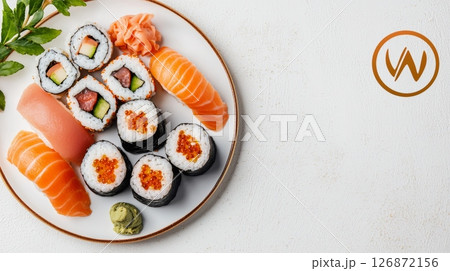 Elegant Dinner Concept with Sushi Platter Featuring Fresh Salmon and Rolls on a White Plate 126872156