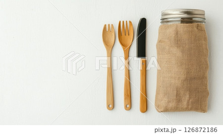 Eco-Friendly Zero Waste Concept with Bamboo Cutlery and Reusable Jar on White Background Eco-Friendly Zero Waste Concept with Bamboo Cutlery and Reusable Jar on White Background 126872186