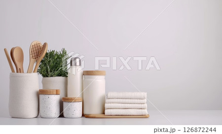 Zero Waste Concept with Eco-Friendly Kitchen Utensils and Reusable Containers on Minimalist Background Zero Waste Concept with Eco-Friendly Kitchen Utensils and Reusable Containers on Minimalist Background 126872244