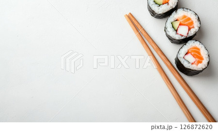 Delicious Sushi Rolls and Chopsticks on White Background - Perfect for Lunch Breaks and Food Concepts Delicious Sushi Rolls and Chopsticks on White Background - Perfect for Lunch Breaks and Food Concepts 126872620