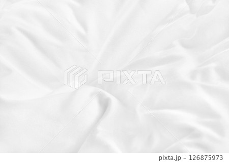 Close up top view of white bedding sheet and wrinkle messy blanket in bedroom after wake up in the morning. 126875973