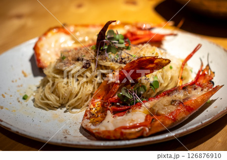 Spaghetti with grilled river prawn served on plate 126876910