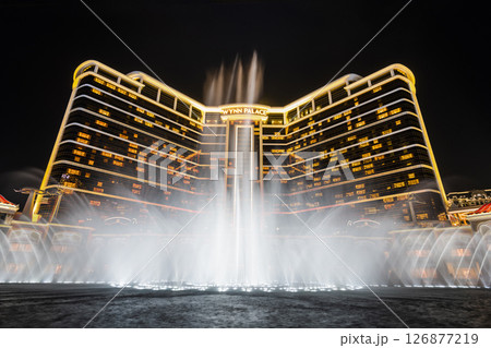 Beautiful night view of Wynn Palace Performance Lake displays a water, music, and light show, is a hotel casino resort on the Cotai Strip in Macau, China. Beautiful night view of Wynn Palace Performance Lake displays a water, music, and light show, is a hotel casino resort on the Cotai Strip in Macau, China. 126877219