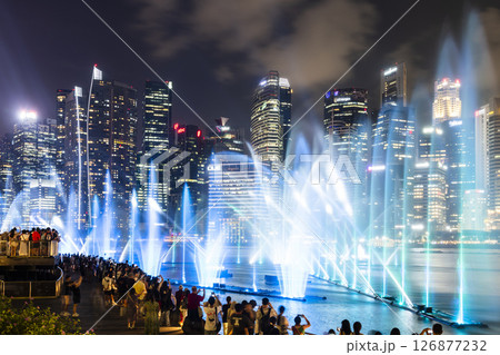 Beautiful view of the nightly music, water, and light show at Marina Bay Sands, here is an integrated resort fronting Marina Bay in Singapore. 126877232