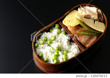 おかずたっぷり豆ご飯弁当を黒背景で撮影 おかずたっぷり豆ご飯弁当を黒背景で撮影 126879215