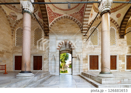 istanbul, turkiye - aug 18 2015: court of blue mosque. open door between columns 126881653