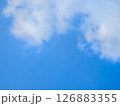 Vast blue sky with fluffy white clouds on a bright day 126883355
