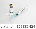 Vial of Covid-19 vaccine and 1 ml plastic syringe with needle isolated on the white background 126883426