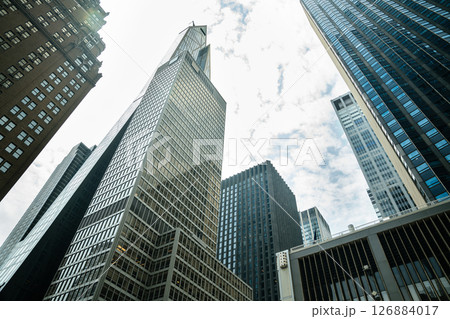 Glass and concrete towers dominate the skyline of Manhattan. Iconic high-rise architecture defines the city's financial and business power. 126884017
