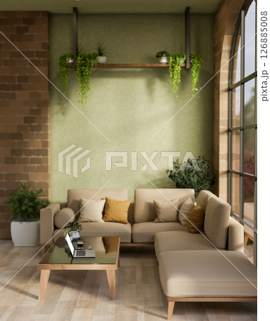 The laptop on glass top wooden table with fabric sofas in cosy cafe or a lounge with green wall. 126885008