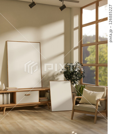 The large blank drawing frames in the corner of white wall room next to a wooden table and armchair. 126885227