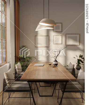 A wooden square table and stylish armchairs next to a large window with sunlight and lamp light. A wooden square table and stylish armchairs next to a large window with sunlight and lamp light. 126885231