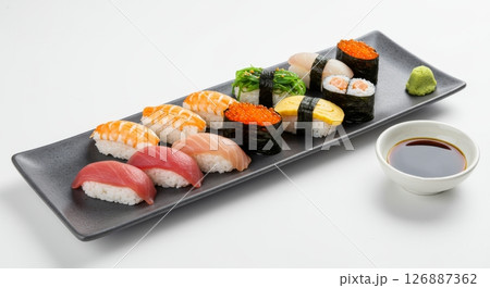 Delicious Assortment of Fresh Sushi Nigiri and Maki Platter with Soy Sauce and Wasabi Delicious Assortment of Fresh Sushi Nigiri and Maki Platter with Soy Sauce and Wasabi 126887362