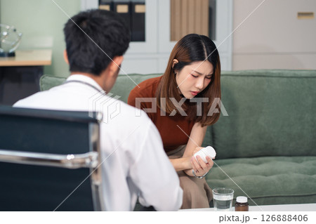 Female patient receiving therapy for depression and stress in a psychiatric clinic. 126888406