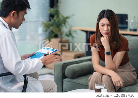 Female patient receiving therapy for depression and stress in a psychiatric clinic. 126888410