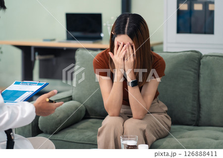 Female patient receiving therapy for depression and stress in a psychiatric clinic. 126888411